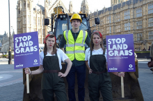 Oxfam activists protesting against land grabs (Photo: oxfamnorthengland/flickr)